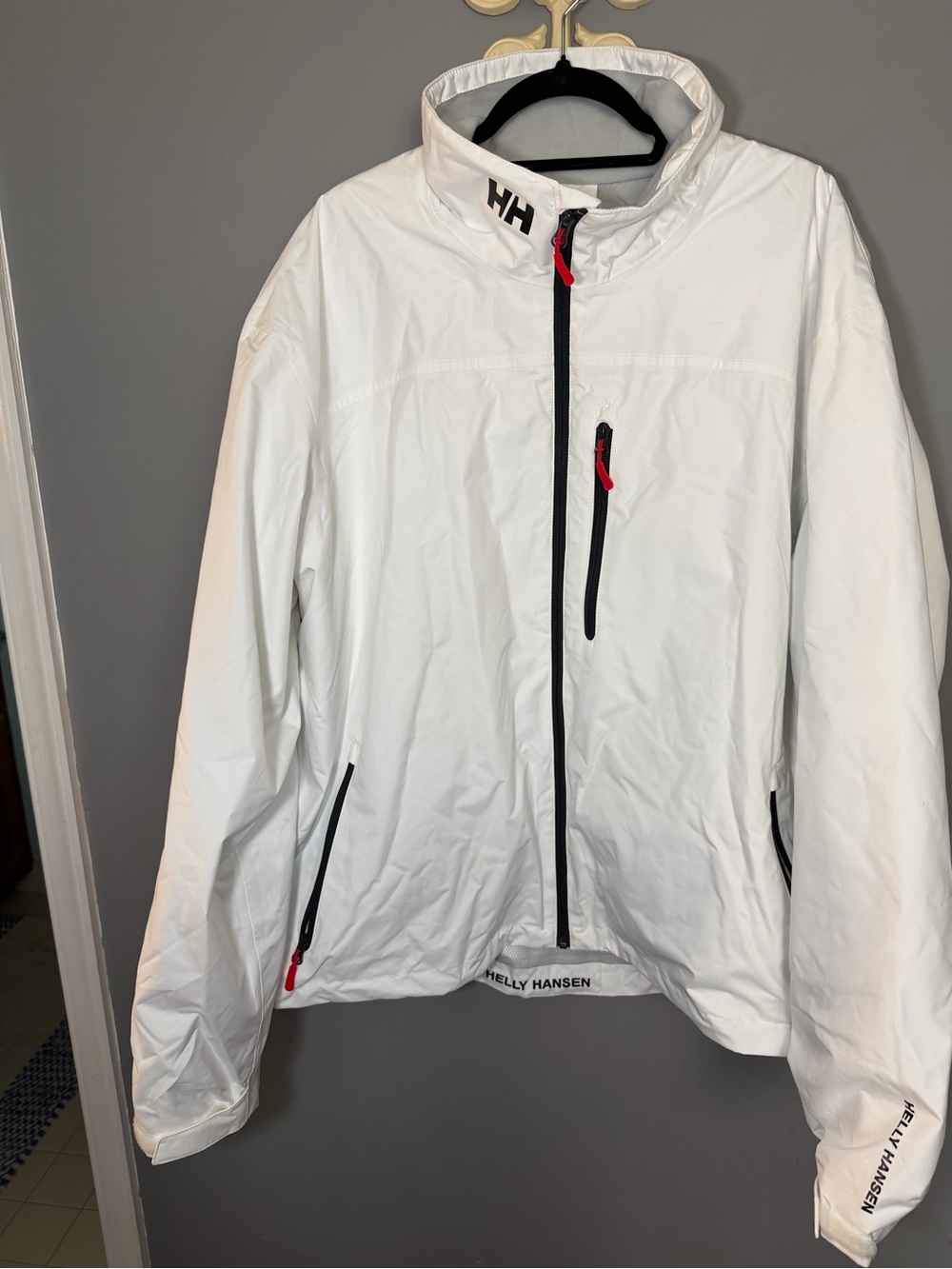 Helly Hansen White Jacket with Black Accents and Red Pull